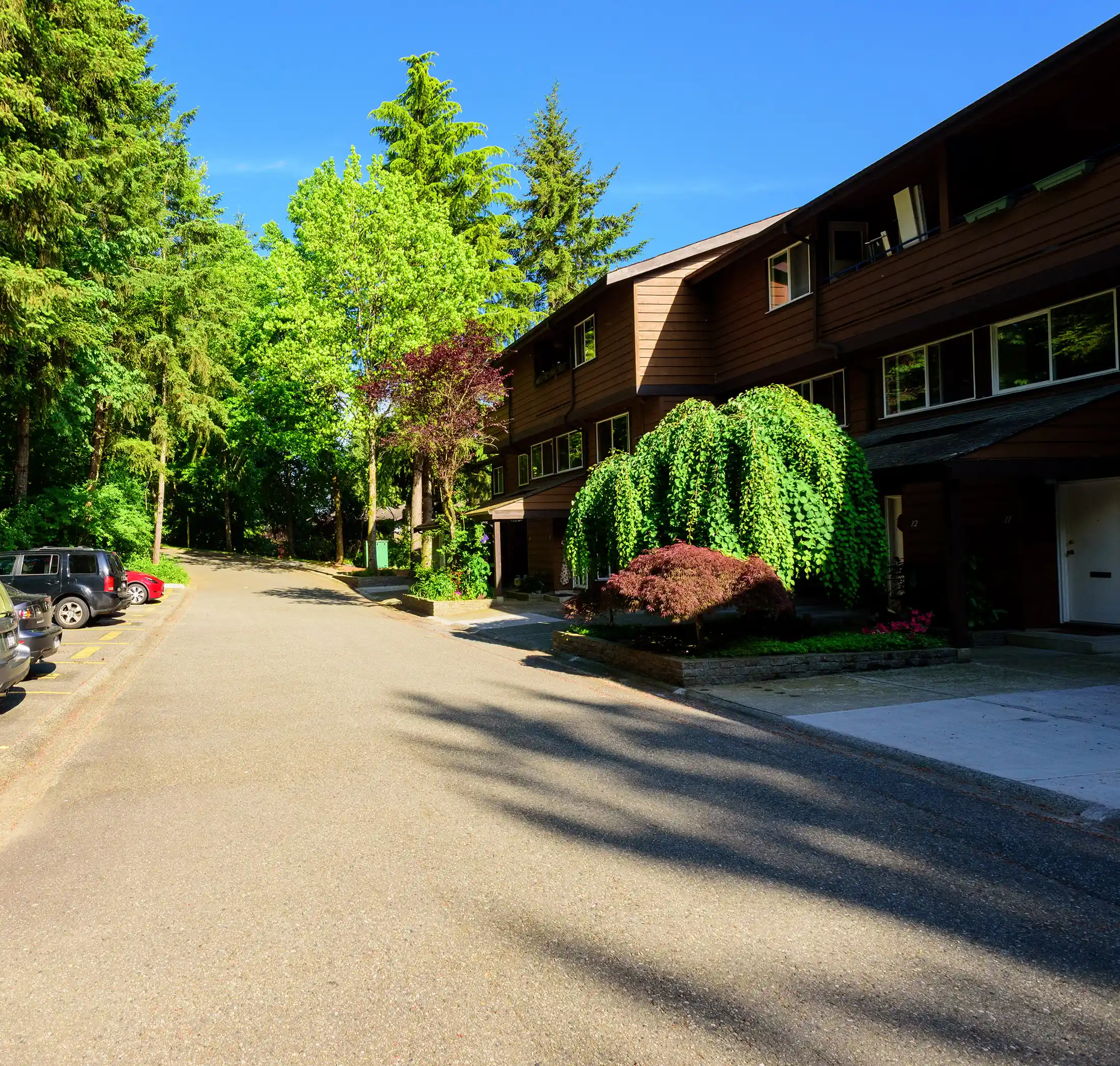 A-block units surrounded by lush greenery