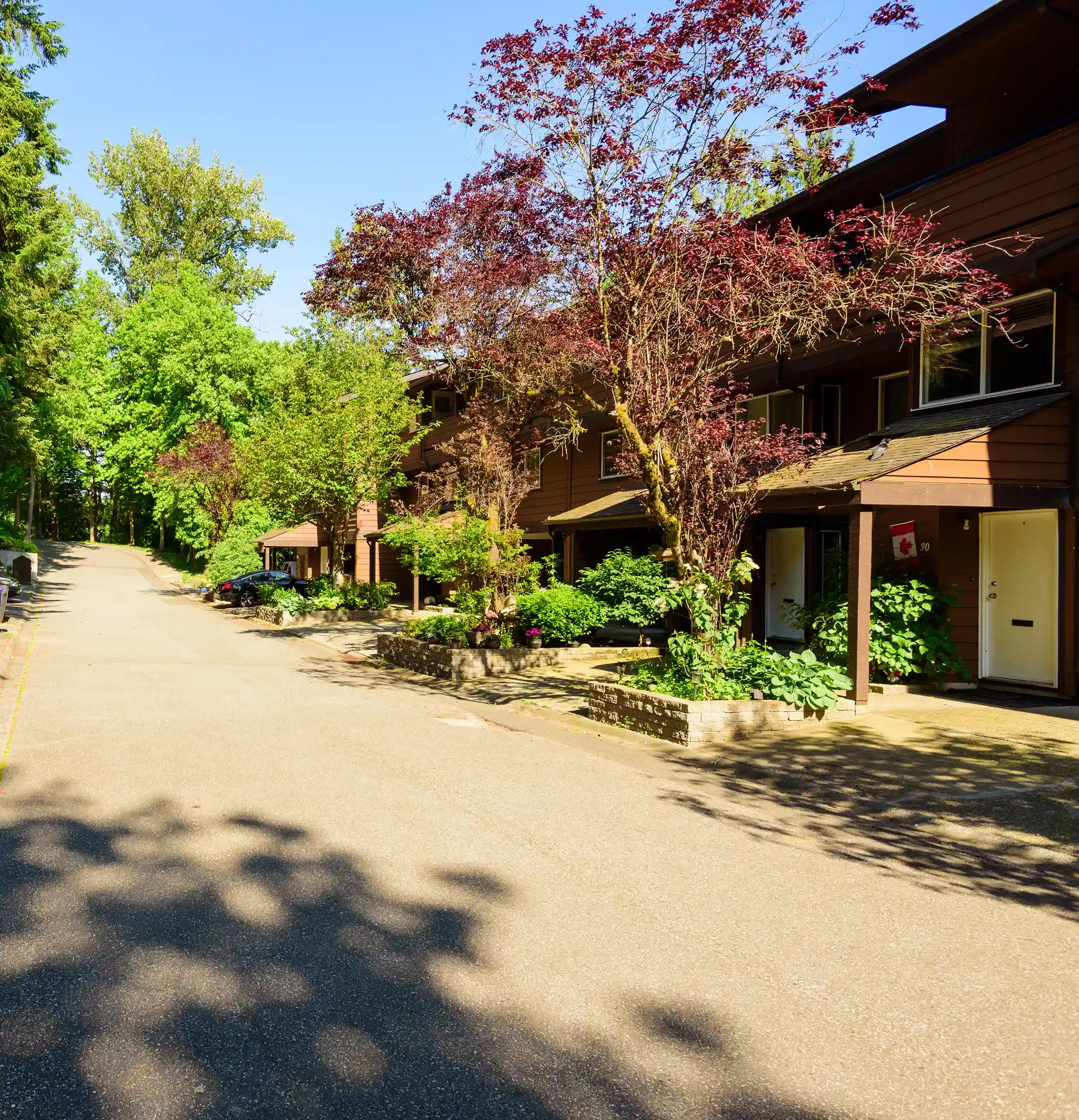 F-block units surrounded by lush greenery