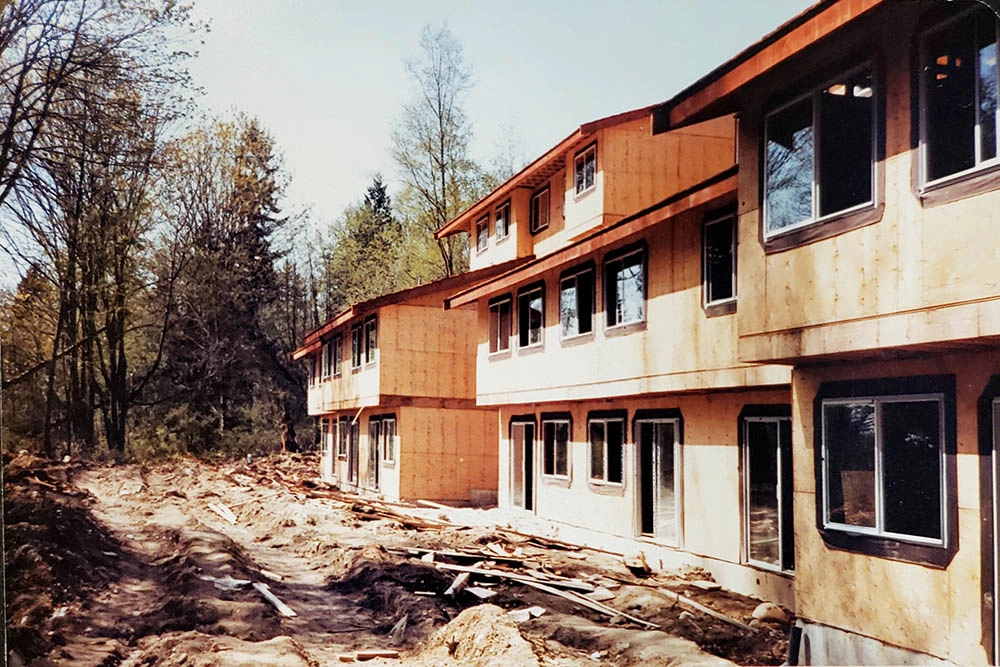 Plywood building sheathing phase showing window frames installed
