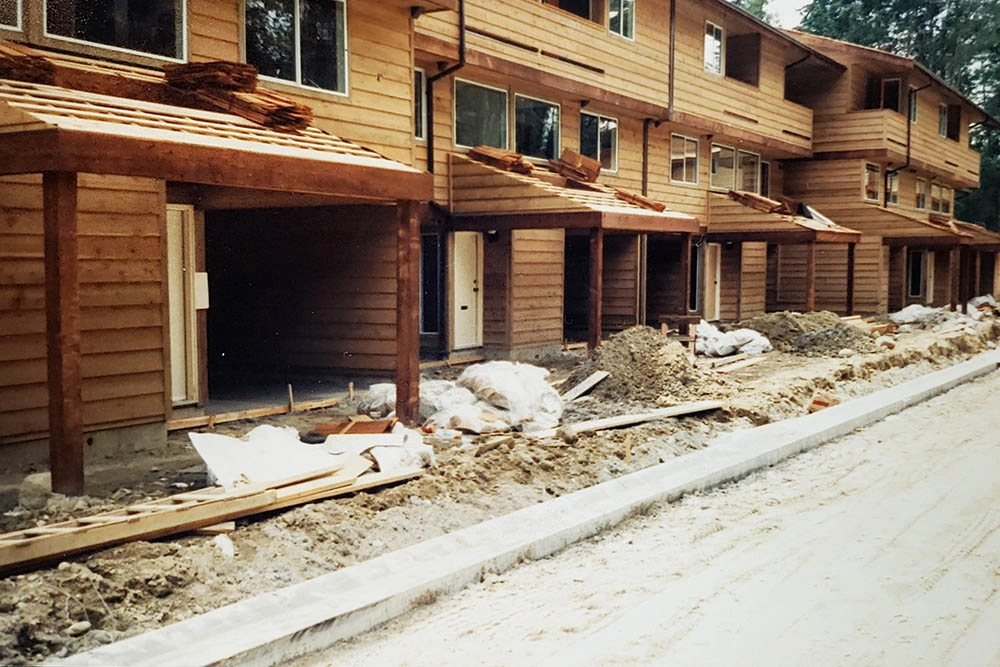 Close up view of townhome unit front entrances and porch roofing installation